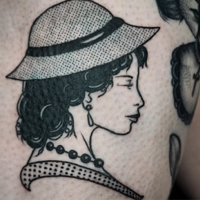 Gavin Jones on the Art of Tattooing - tattoo of lady wearing a hat